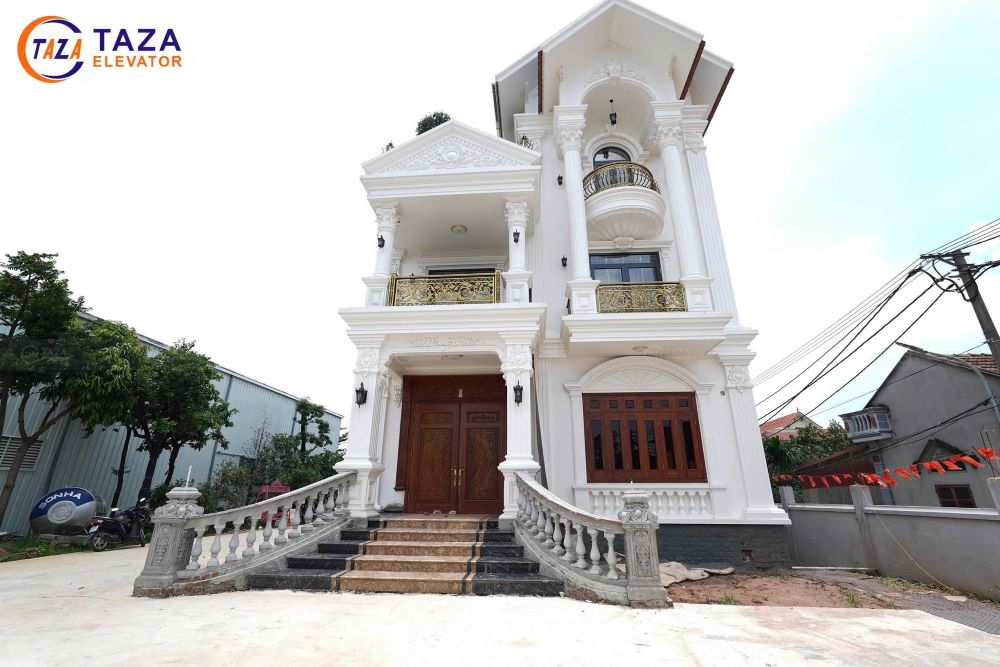 Bàn giao thang máy kính inox gương vàng cho biệt thự tân cổ điển